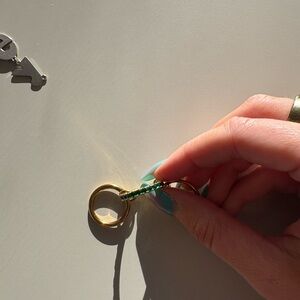 Spinelli ring with green diamonds